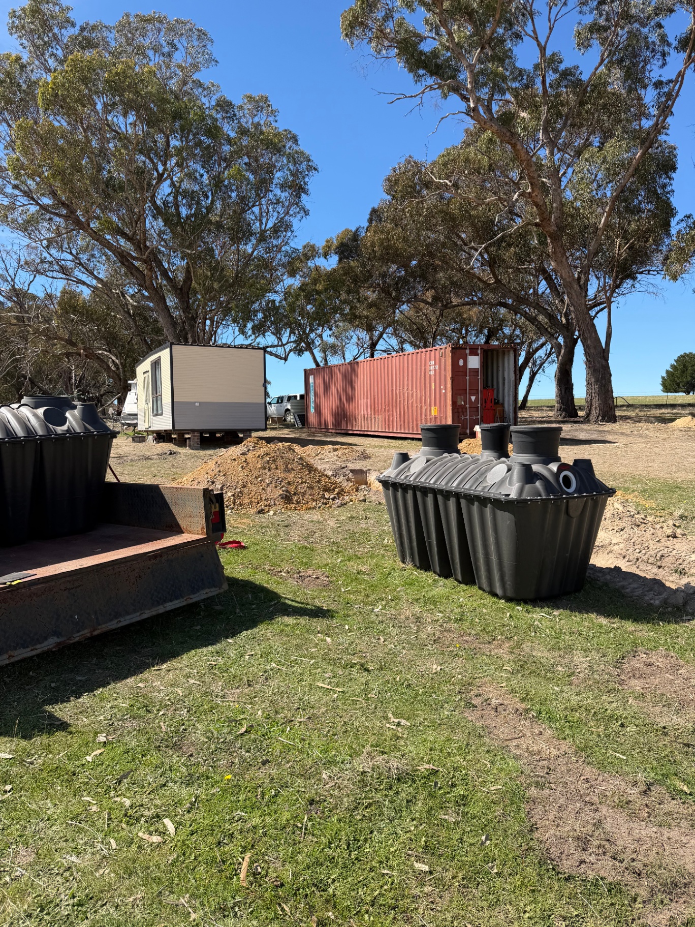 1500L Bush Billabongs septic tank delivered on-site at a rural Australian property next to a tiny home